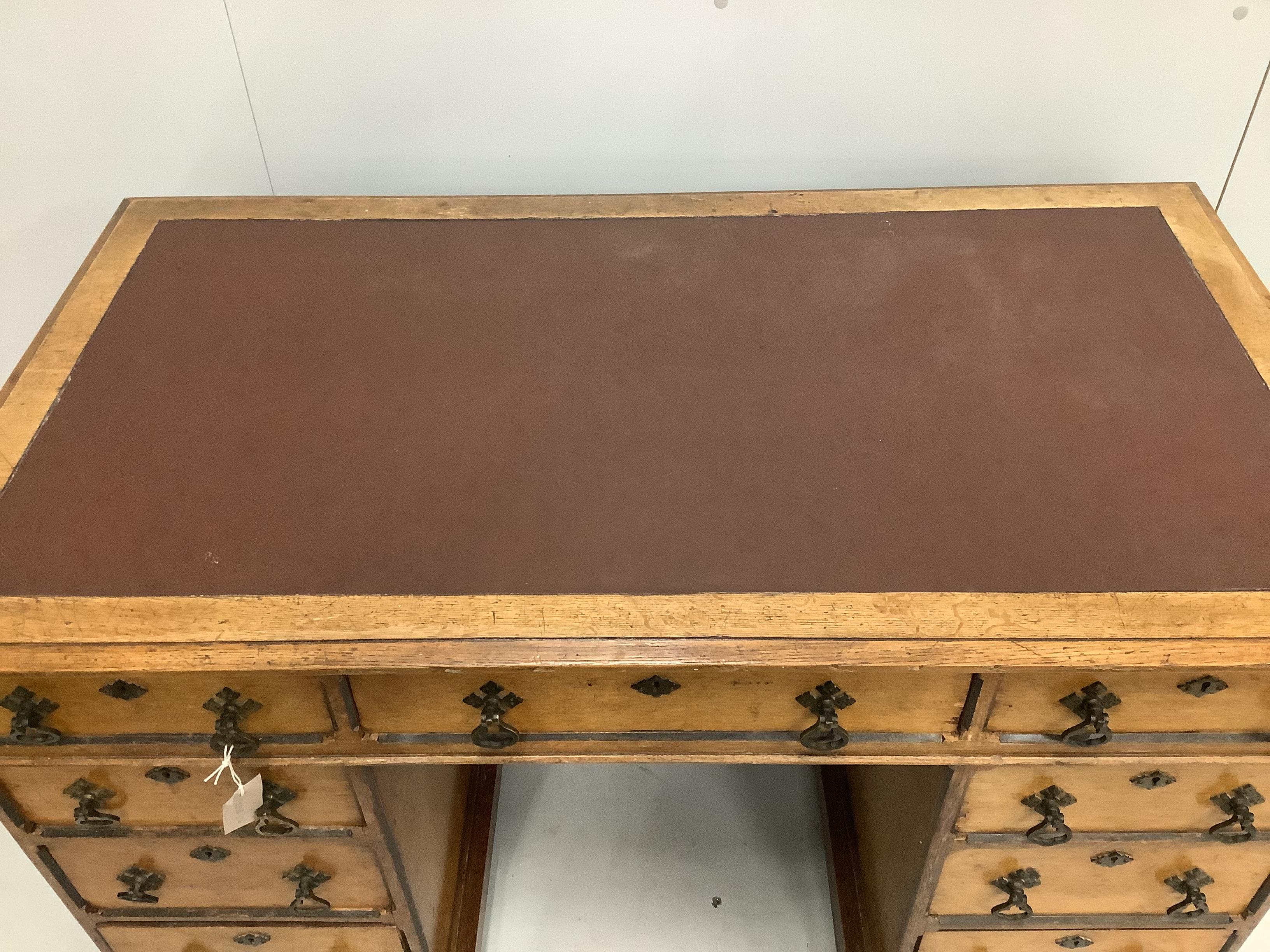 A late Victorian Aesthetic movement oak pedestal desk, width 122cm, depth 67cm, height 76cm